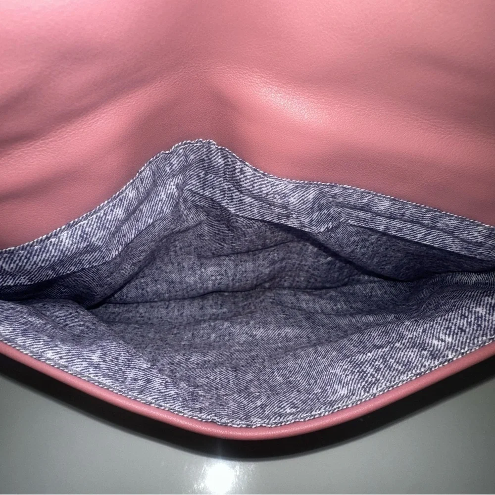 Urban Expressions Pink Laser Cut “Locket” Clutch. New without tags